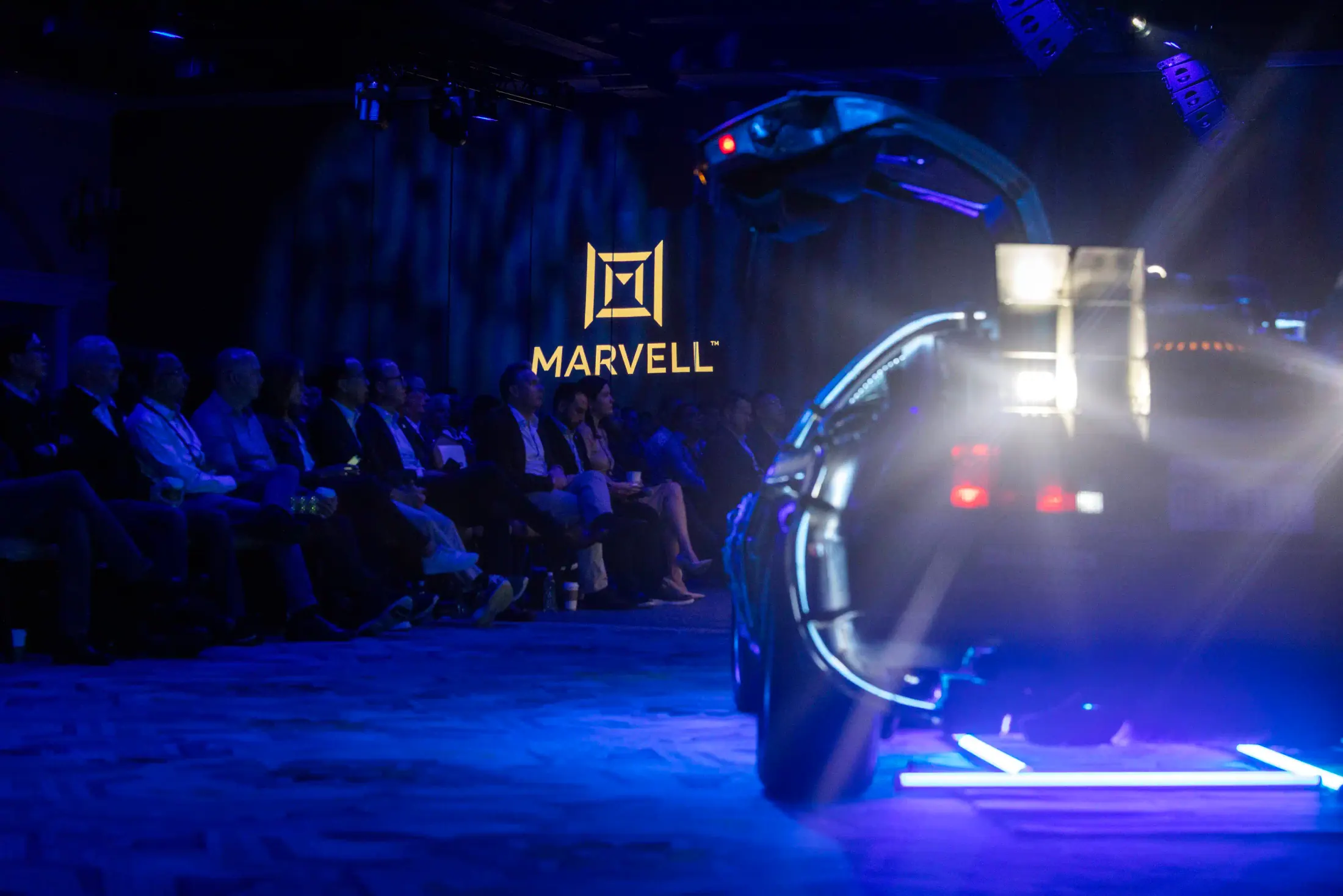 Sales Conference stage and audience with display car.