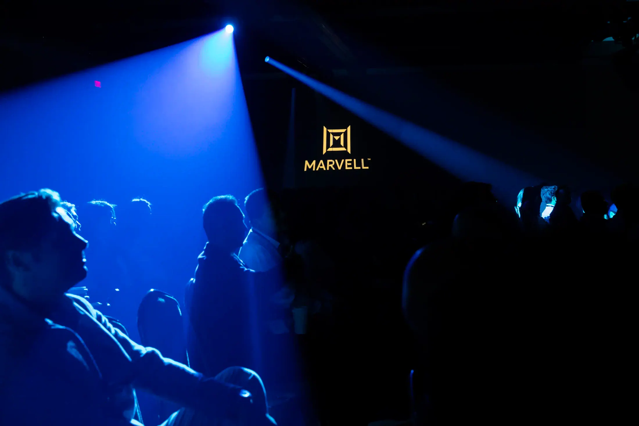 Sales Conference audience facing a branded stage.